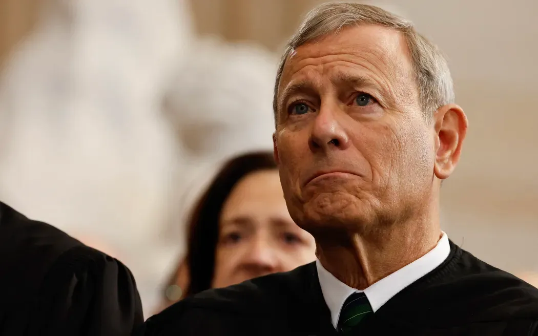 John Roberts looking miserable